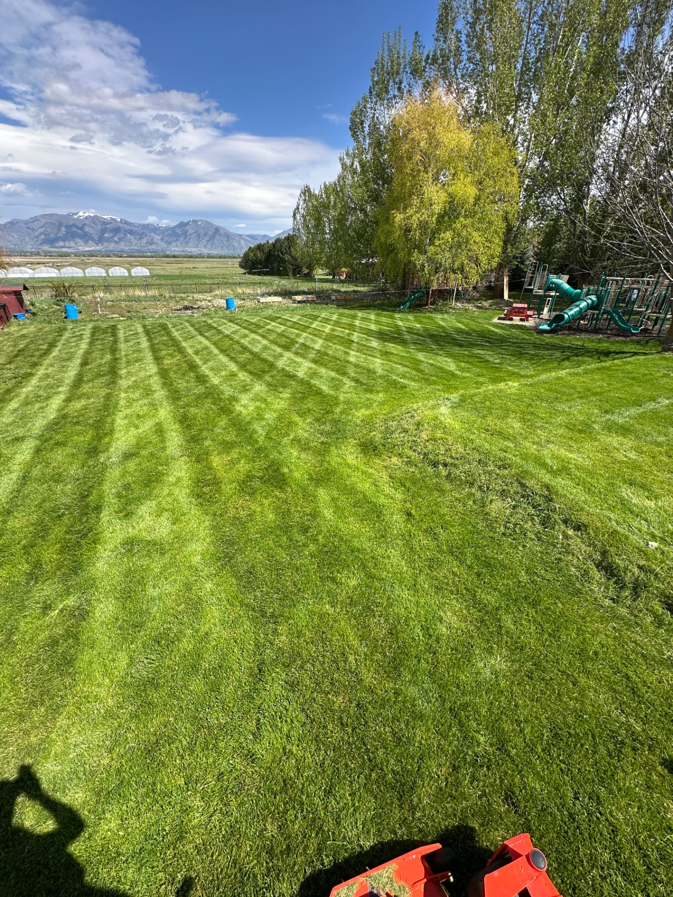 Manicured backyard with Cache Valley mountain views — Groll Lawn Care